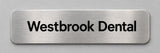 Satin aluminum nameplate with rounded corners and black screen printed lettering reading Westbrook Dental