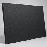 Black King StarBoard marine-grade HDPE sheet at an angle, showing the matte stippled surface texture and a thick machined cut edge